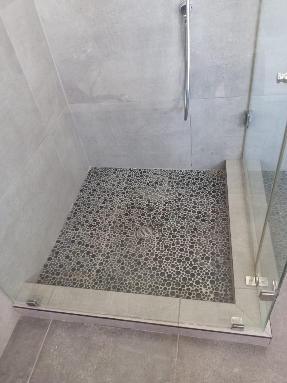 Professional tiler aligning ceramic tiles for seemless pattern
